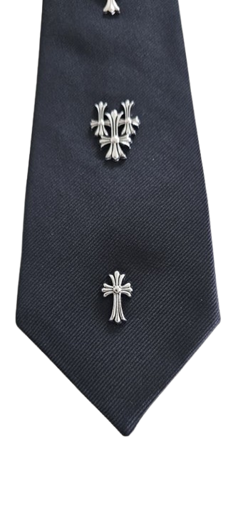 Black tie with silver cross-shaped pins on a white background