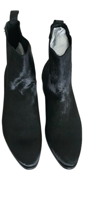 Pair of black ankle boots on a white background