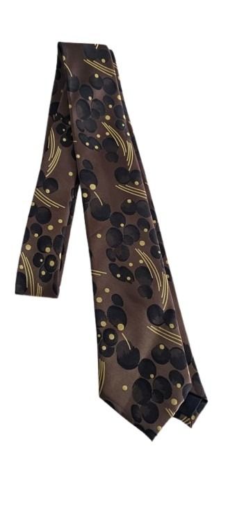 Sleek black and gold patterned tie on a white background