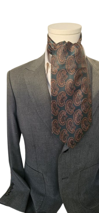 Gray suit with a patterned cravat on a mannequin against a white background