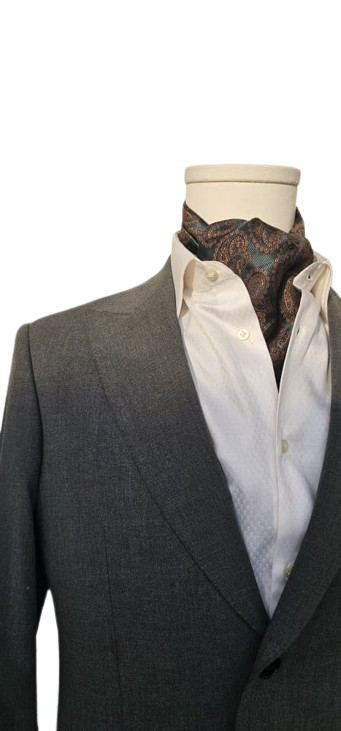 Gray suit jacket over a white shirt with a patterned tie on a mannequin against a white background