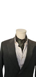 Mannequin wearing a dark suit with a white shirt and patterned tie on a white background