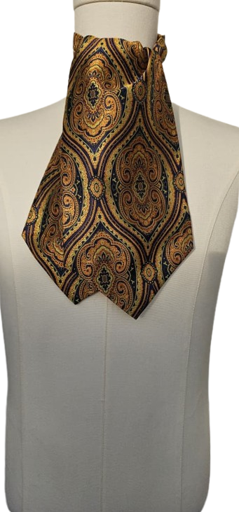 Patterned ascot tie on a mannequin against a white background