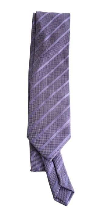 Folded purple striped tie on a white background