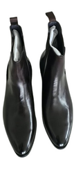 Pair of black leather ankle boots on a white background