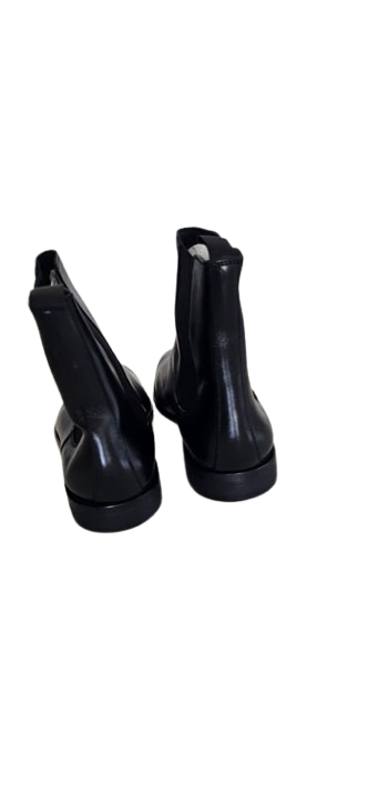 Pair of black rubber boots on a white background