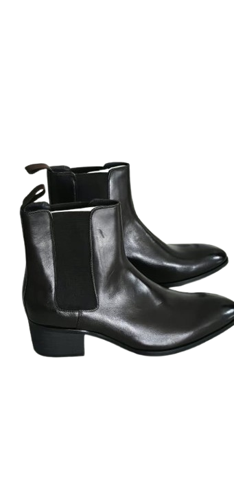 Pair of black leather ankle boots on a white background