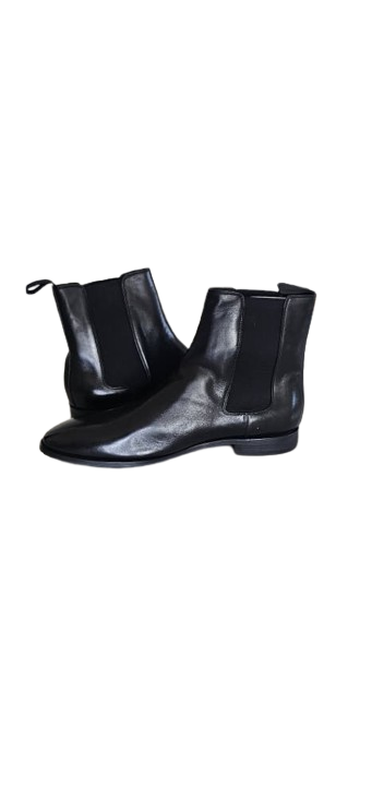 Black leather ankle boots on a white background