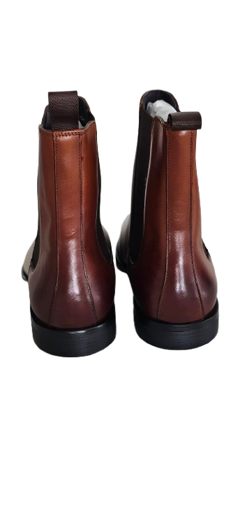 Pair of brown leather boots on a white background