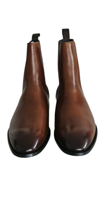 Pair of brown leather boots on a white background
