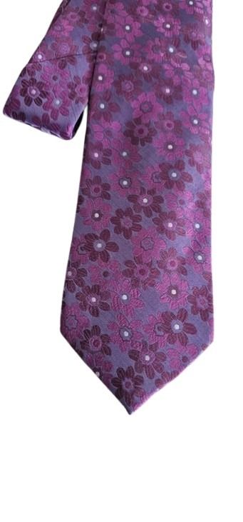 Purple floral patterned tie on a white background