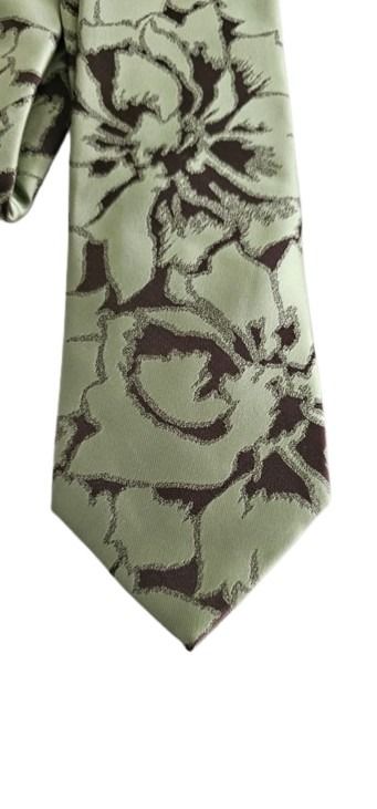 Green floral patterned tie on a white background